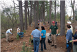 Volunteers stand and talk before starting work.