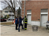 Firefighters Setting up Large Ladder