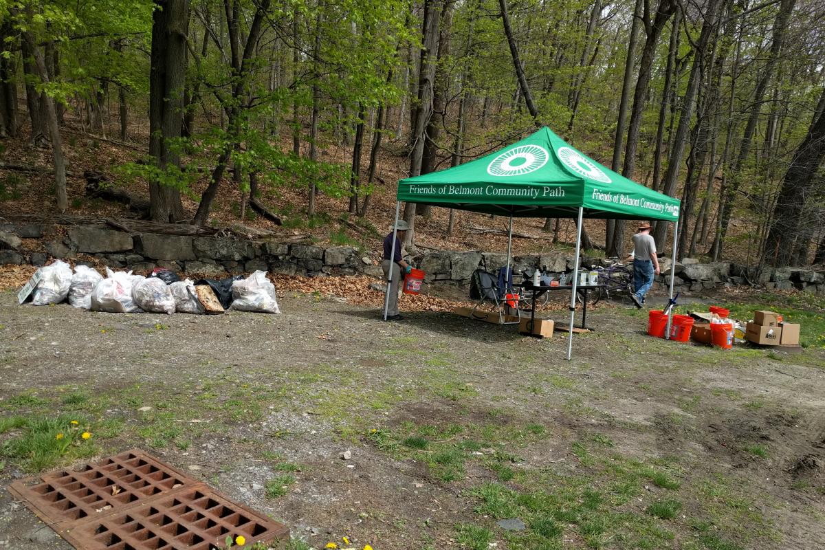 Volunteer tent and bags of trash