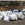 A dozen large bags of trash and some boxes contain trash that has been cleaned up.