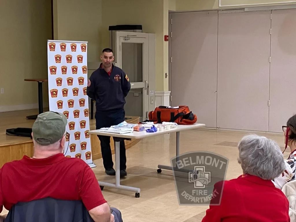 Firefighter Standing at Front of Room for Citizen CPR Class